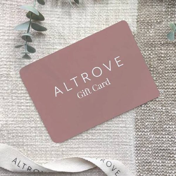 A gift card on a soft blanket