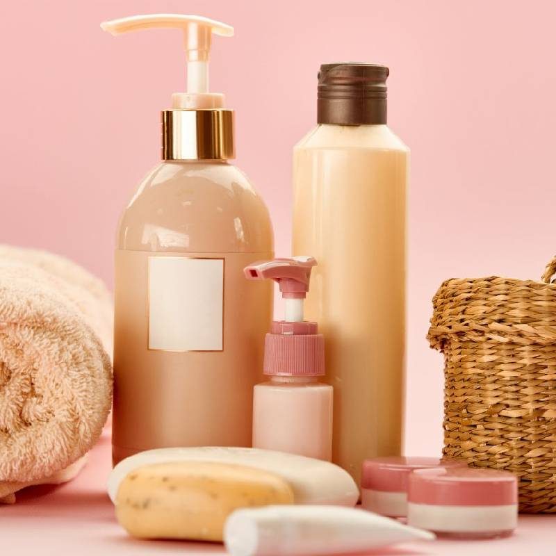 Soft pink skincare and body care bottles